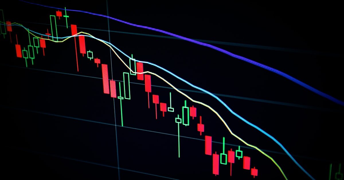 Candlestick stock chart glowing on a dark trading screen. Weighing thematic ETF bets against a broad index fund